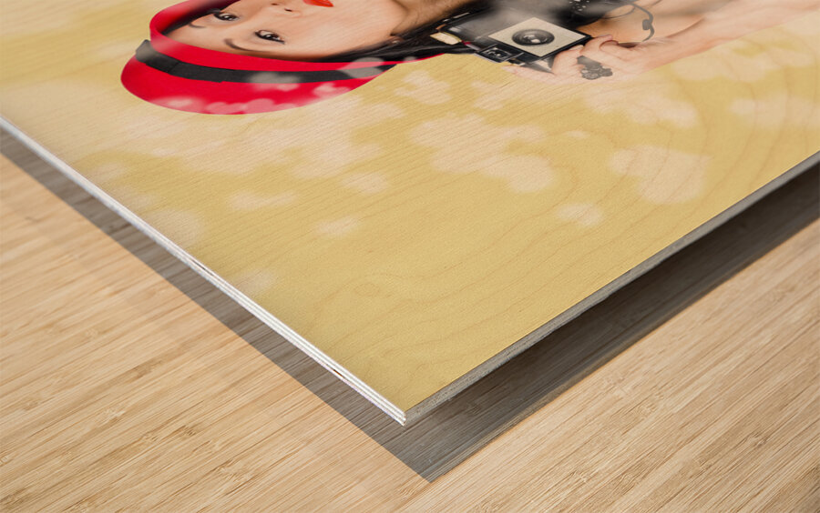 Photographer taking photos with retro film camera Wood print