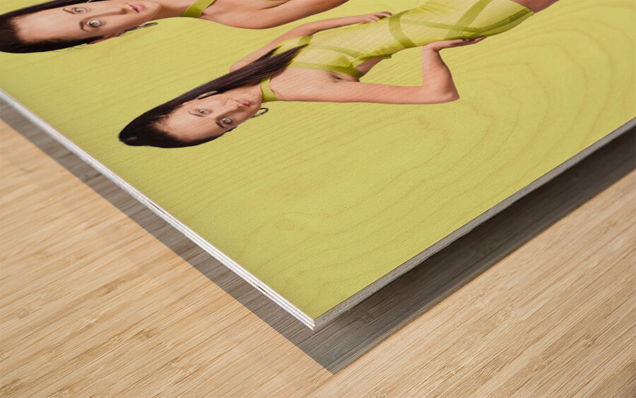 Spring fashion. Young girl in retro green dress Wood print