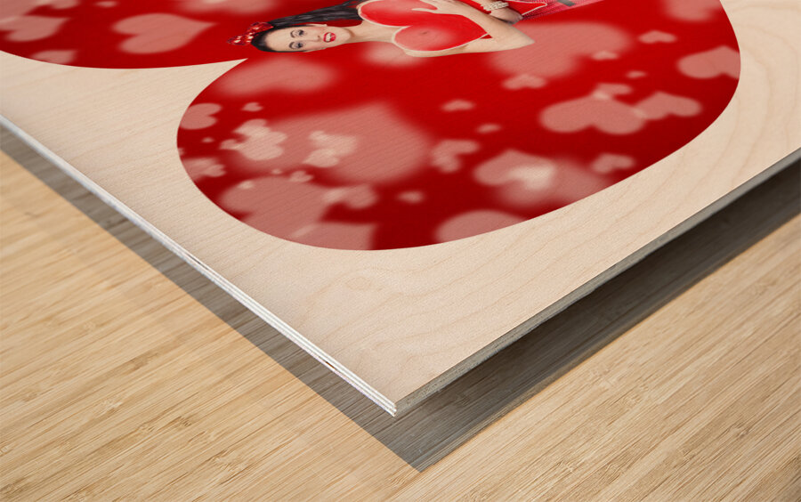 Valentines day woman holding love heart card Wood print