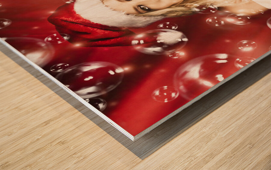 Attractive Christmas Woman Blowing Magic Bubbles Wood print