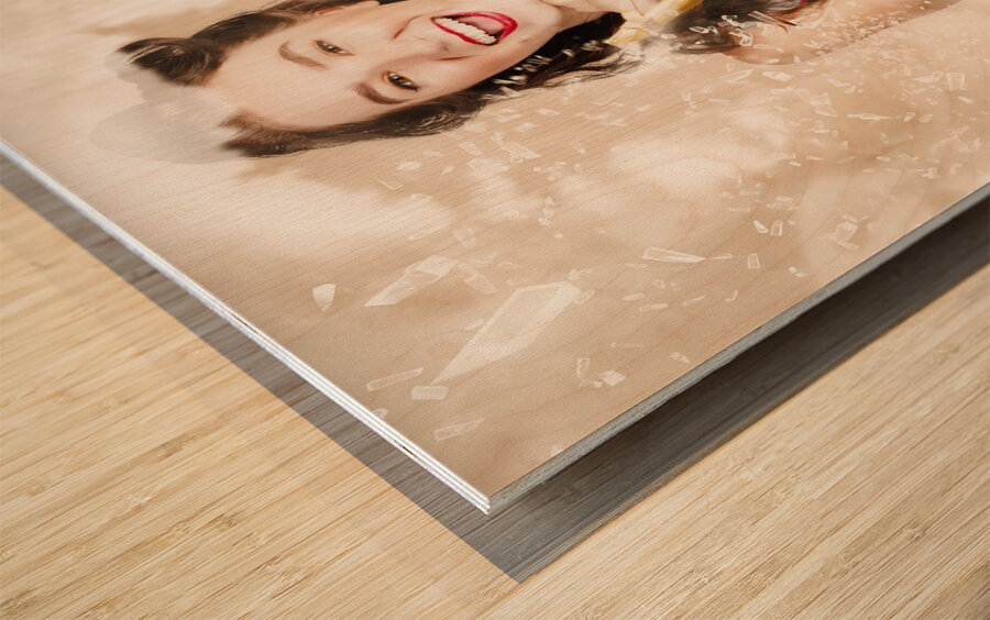 Pinup woman shooting rocks with toy slingshot Wood print