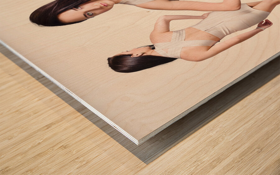 Beautiful young women standing in trendy fashion Wood print