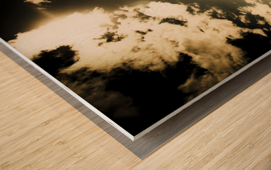 Young Man In Silhouette Sitting In The Sun Wood print