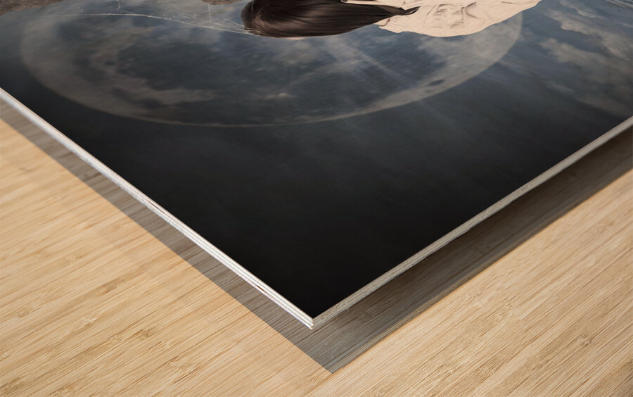 Grieving gothic girl crying next to gravestone Wood print