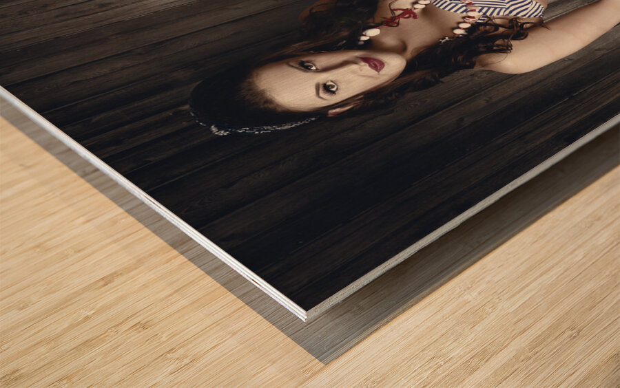 Young brunette pin-up woman on old film projector Wood print