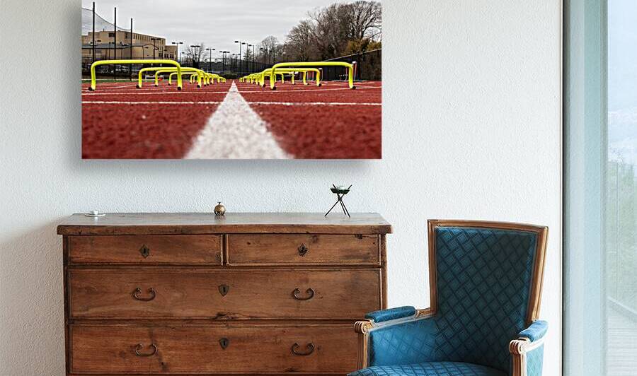 Looking at two rows of yellow mini banana hurdles on a track by Woodys Photos