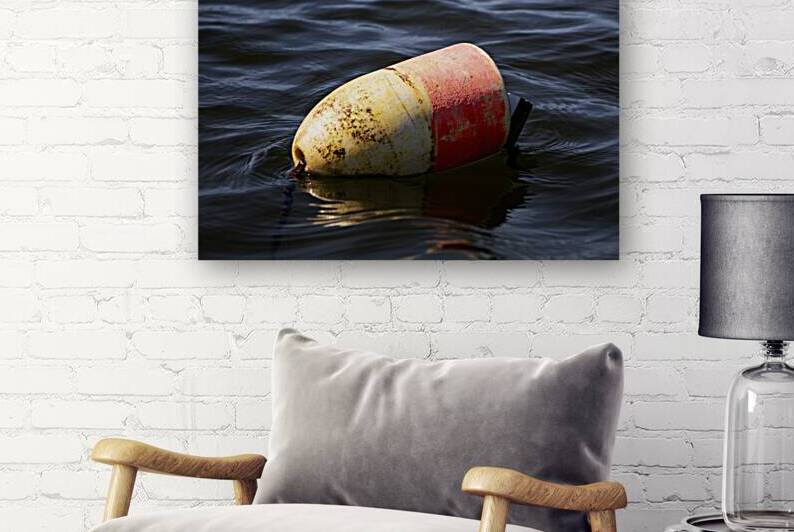 Floating Buoy in Calm Water Close Up by Woodys Photos