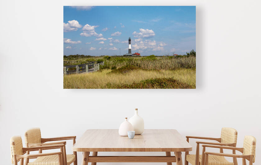 Looking east at the Fire Island Lighthouse in the distance with the boardwalk and beach grass in the foreground by Woodys Photos