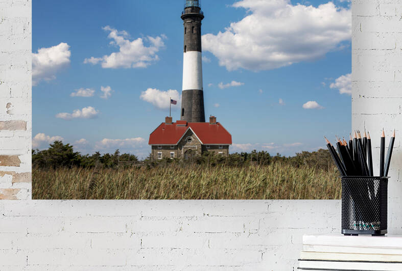 The Fire Island Lighthouse with dry beachgrass in the foreground by Woodys Photos