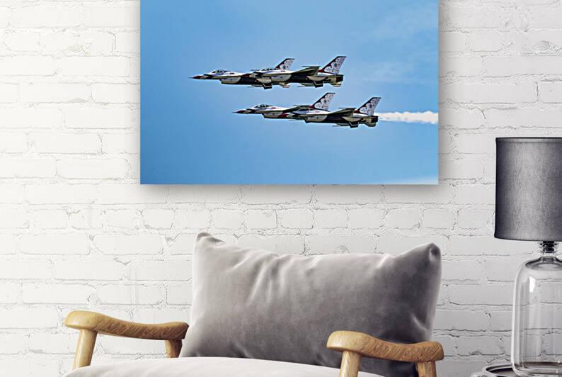 Side view of USAF Thunderbirds flying close toget by Woodys Photos