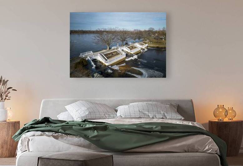 Lake with waterfalls from above with ice foring.j by Woodys Photos