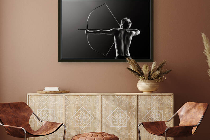 Male archer drawing long bow by Johan Swanepoel