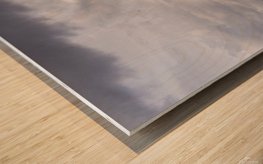 Rainbow with diagonal clouds over morning light on mountains Wood print