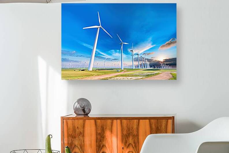 A vast landscape dominated by a series of wind tu by Mirela Poiana