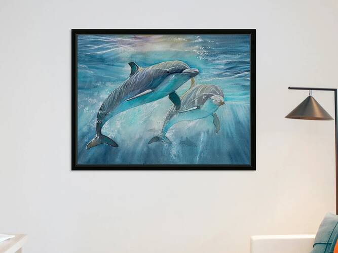 Dolphins in the ocean by Hubert ABITBOL