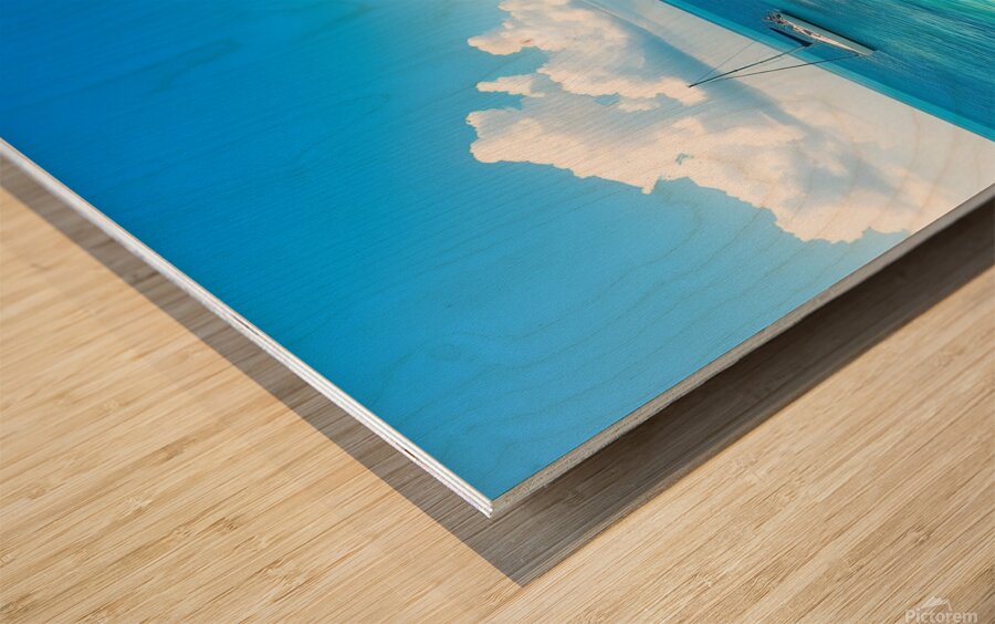 Tropical Paradise with Turquoise Waters Palm Trees and a Sailing Yacht Wood print