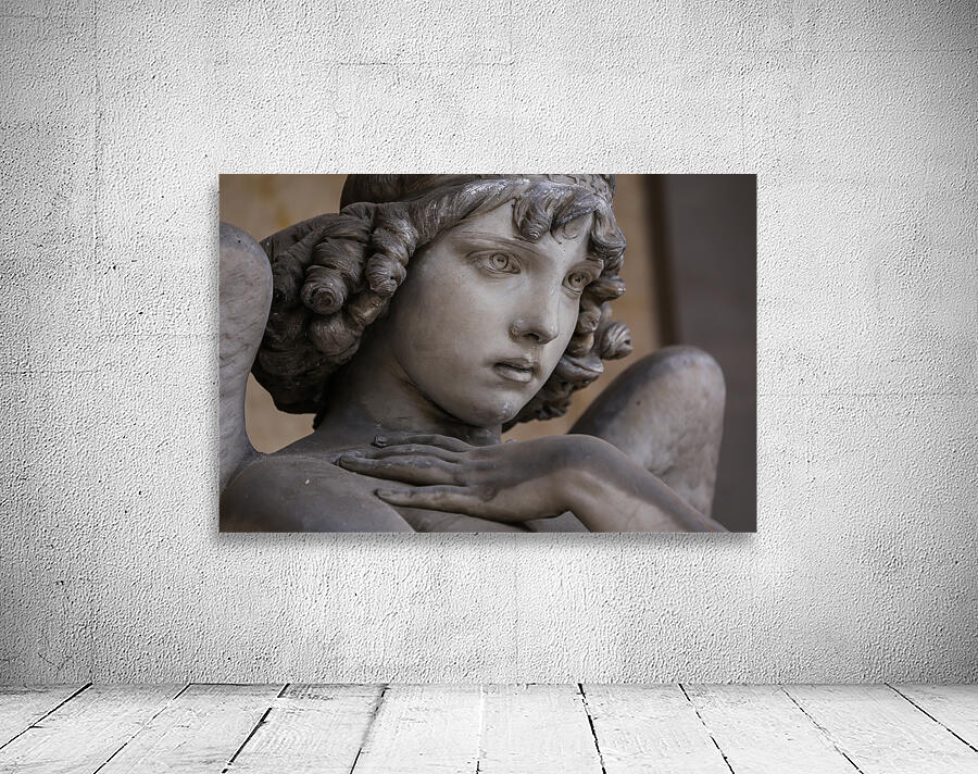 Guardian angel statue in antique cemetery. Wall Preview