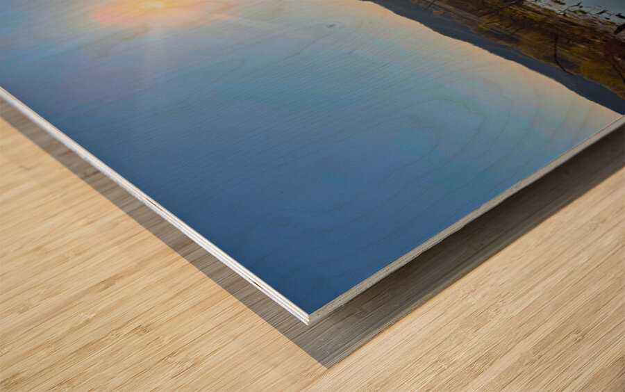 Sunrise Over Tranquil Wetlands with Sunbeam Reflection Wood print