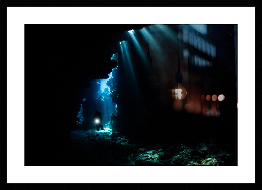 Underwater cave with diver by Anthony Leydet