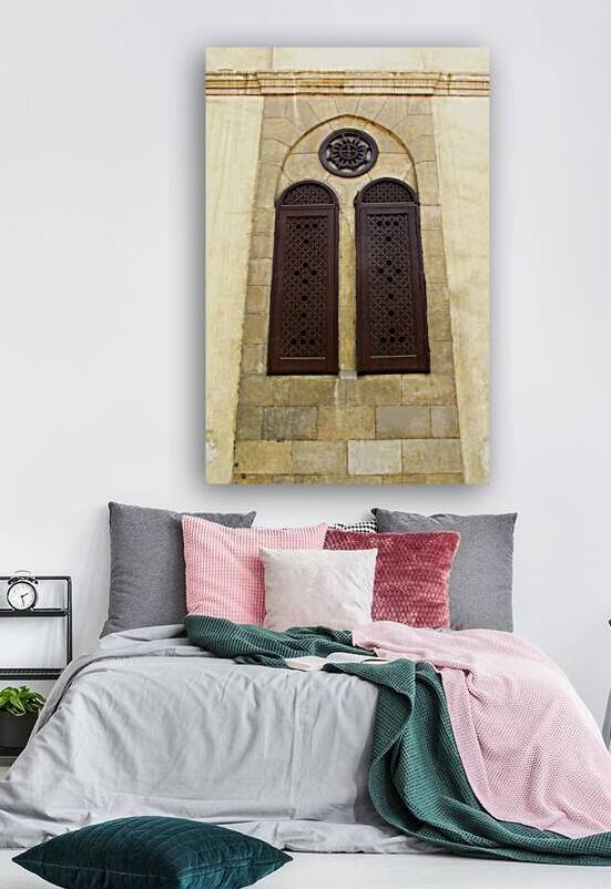 Wooden brown carved shutters on the windows on the wall of Coptic Christian Orthodox  church of St. Mary  in Cairo by Vitaliy Borisov