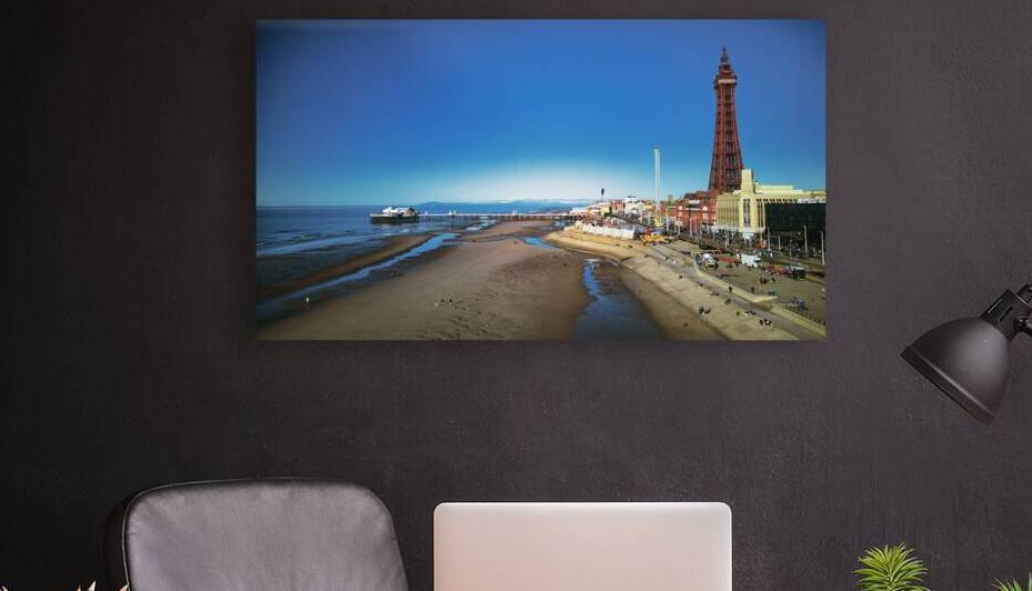 Scenic view of Blackpool beach and tower on a sunny day with clear blue skies and calm sea popular UK seaside destination. by Vasile Jechiu