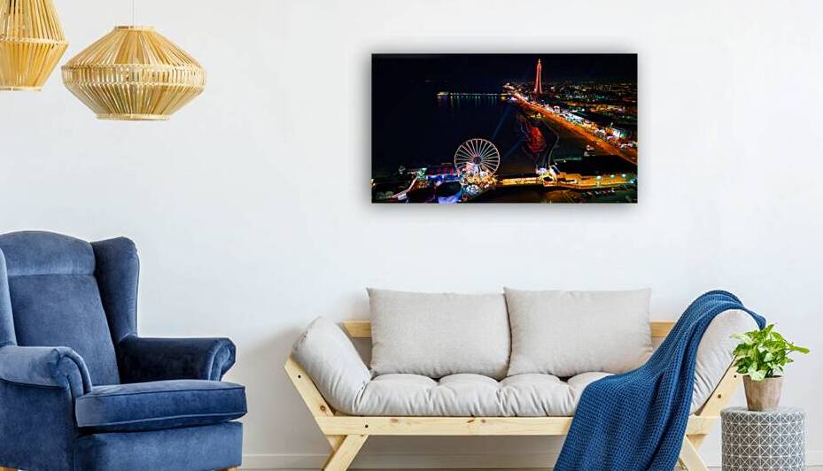 Aerial night view of a vibrant amusement park with illuminated Ferris wheel and tower by the seaside in Backpool England. by Vasile Jechiu