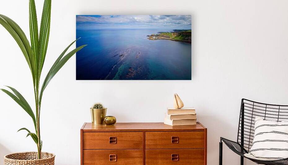 Aerial view of coastal landscape with clear waters and green cliffs at Cayton Bay Yorkshire by Vasile Jechiu