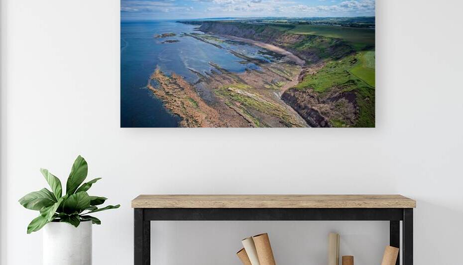 Aerial view of coastal cliffs and rocky shorelines at Cayton Bay Yorkshire by Vasile Jechiu
