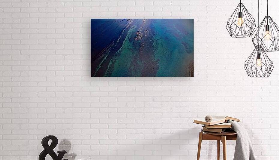 Aerial view of clear blue ocean and coral reefs at Cayton Bay Yorkshire by Vasile Jechiu