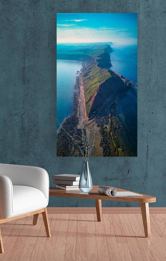 Aerial view of a rugged coastline with cliffs and ocean at sunrise in Filey England. by Vasile Jechiu