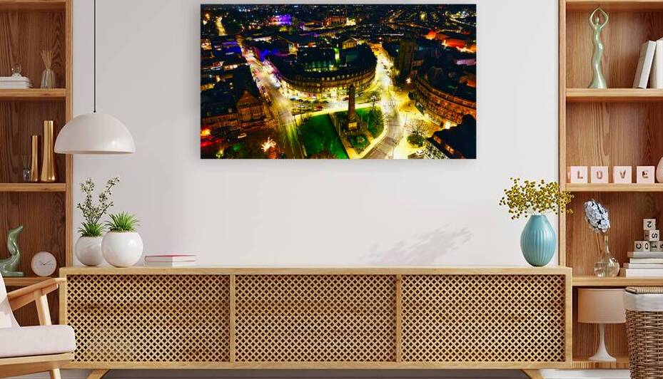 Aerial night view of a vibrant cityscape with illuminated streets and buildings showcasing urban architecture in Harrogate North Yorkshire. by Vasile Jechiu