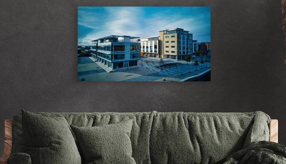 Modern office buildings with glass facades under cloudy sky empty urban business district in Hull England. by Vasile Jechiu