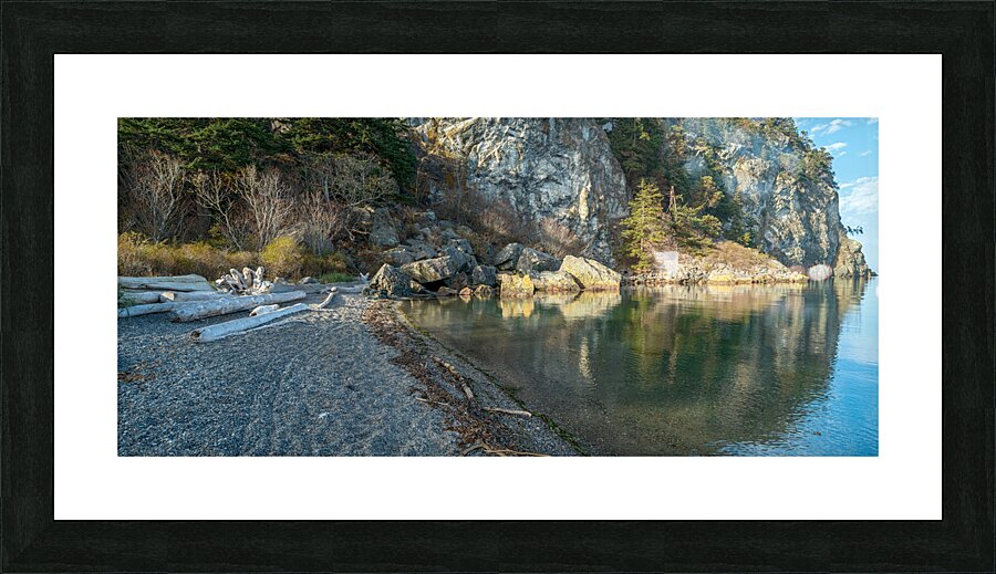 Rock formations and driftwood line the shore of Watmough Bay on  Lopez Island Washington USA Picture Frame print
