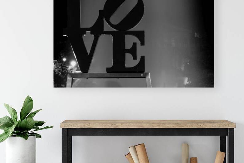 couples pose under love sculpture  horizontal 223 by Black And White